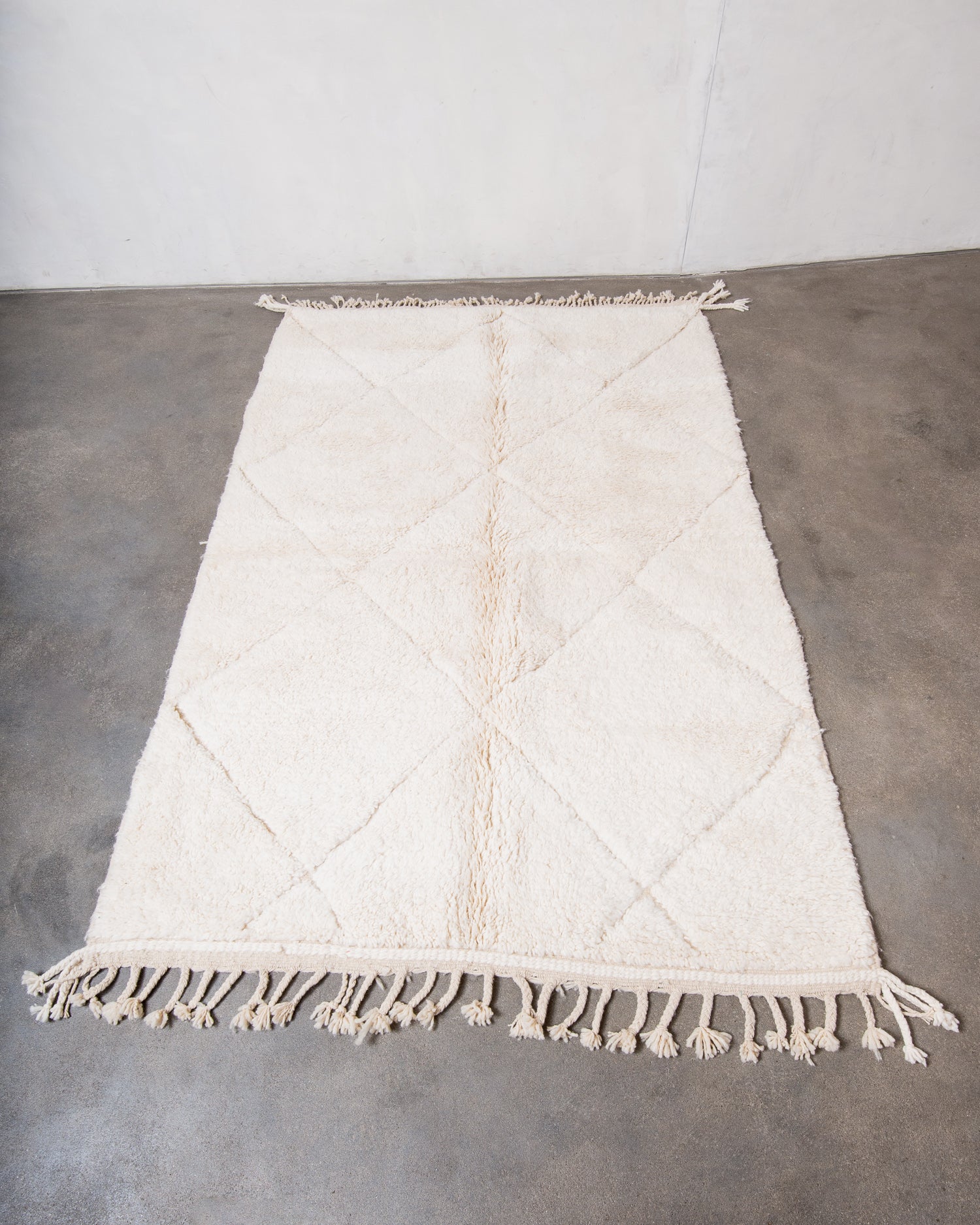 Modern, designer, handcrafted Berber rug from Morocco. Beniourain carpet with minimalist design, natural wool pile and a fluffy texture.